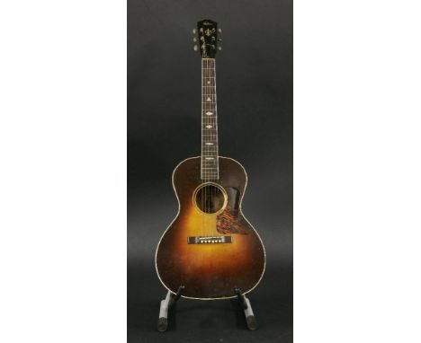 A 1935 Gibson ‘Nick Lucas Special’ acoustic guitar,serial no. 92126 and the FON number appears to be 1890A, but it is not cle