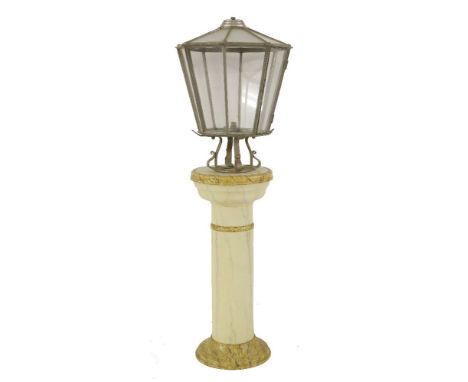 A painted metal and glazed lantern,mounted on a painted 'grained' column,lantern 70cm highoverall 160cm high