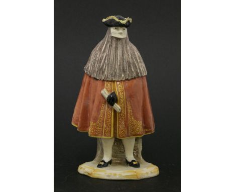 A Cozzi Italian porcelain figure of masked bearded man,19th century, wearing a tricorn hat, red embroidered cloak, standing o