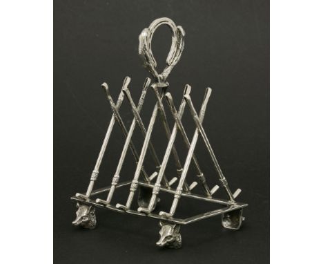 A novelty hunting toast rack,by W W Harrison & Co., Sheffield, 1902, the five divisions modelled as riding crops, the handle 