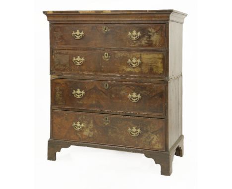 A walnut and feather banded chest of drawers,in two parts, labelled 'Elizabeth Bell & Son at the White Swan against the South