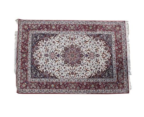 An Esfahan carpet,modern, in fine silky wool, inscribed at one end 'SEIRAFIAN ESFAHAN' and with Arabic script,305 x 201cm