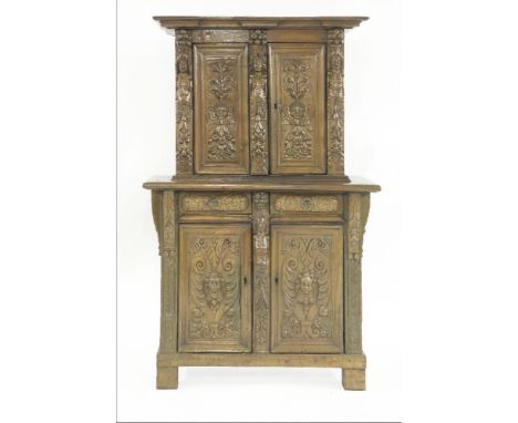 A Franco-Flemish walnut buffet deux corps,16th century, the panels carved with angels and foliage, the top section with three