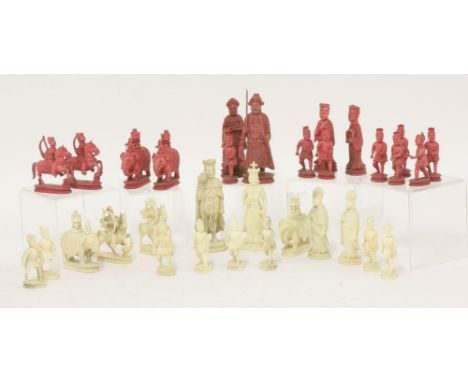 A Canton carved ivory chess set,19th century, natural and stained red, with well carved figures including knights on horsebac