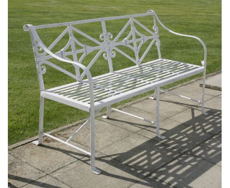 A Regency-style garden bench,repainted, with a scrolled back,152cm wide