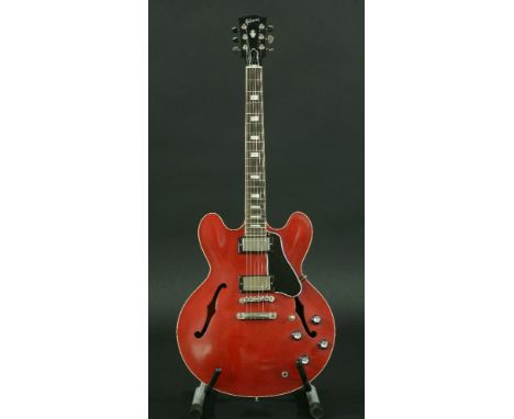 A 2015 Gibson Memphis ES-335 guitar,serial no. 11005756, in a matte red finish with chrome hardware, complete in its original