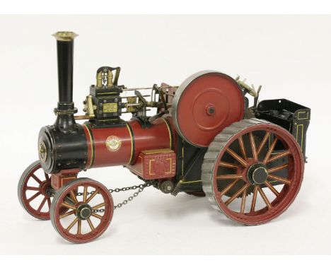 A live steam model of a William Allchin traction engine,in burgundy livery,35cm long
