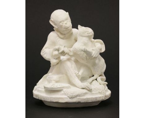 A Minton bisque figure,of a monkey playing with a kitten,17cm high