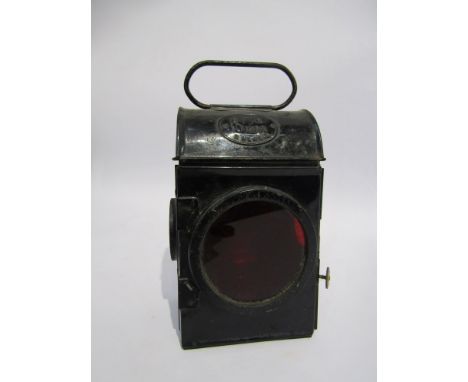 A black painted lamp with three aspects, burner and reservoir. stamped E.R 1953 to top