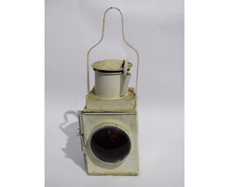 A white painted railway tail lamp