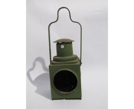 A green painted B.R (Sc) tail lamp, missing aspect and interior