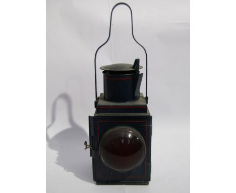 A blue painted and red lined tail lamp, burner and resevoir interior