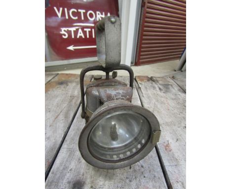 A carbide lamp with brass plaque 'Fill To This Mark'