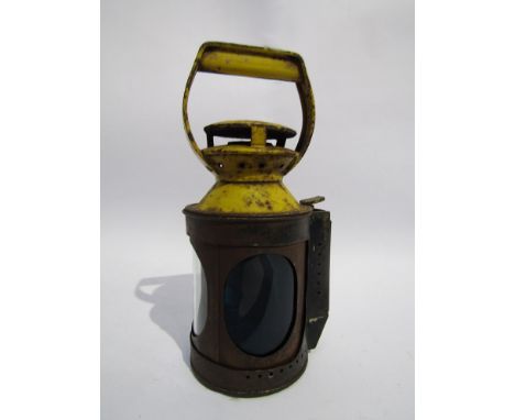 A yellow topped four aspect hand lamp drum interior