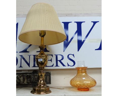 A brass baluster table lamp; a pair of table lamps; a reproduction oil lamp