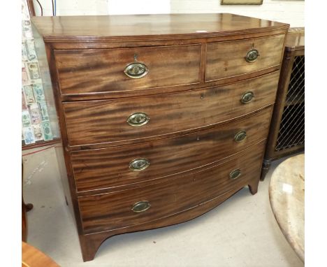 An early 19th century mahogany bow front chest of 3 long and 2 short drawers with brass drop handles and bracket feet