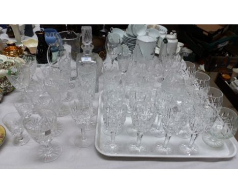 A part suite of Waterford crystal drinking glasses; a decanter; etc.