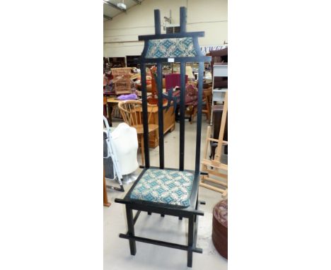 An oriental ebonised high back chair; an ebonised gypsy table on bobbin turned legs