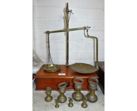 A 19th century Avery 2-pan weighing scale with sets of bell weights, troy weights and avoirdupois weights