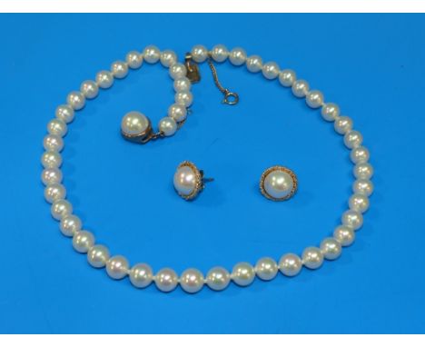 A Majorica simulated pearl necklace with clasp stamped '585', and a pair of half pearl earrings to match
