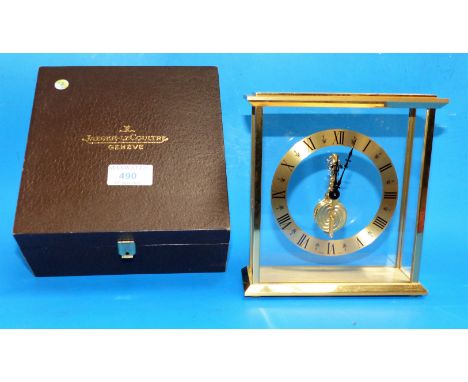 A Jaeger-LeCoultre brass cased 4 glass mantel clock with in-line jewelled watch movement (front glass replaced)