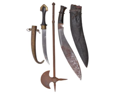 A good kukri, heavy blade 15 in., horn hilt with white metal collar, leather covered scabbard with modest stitched decoration