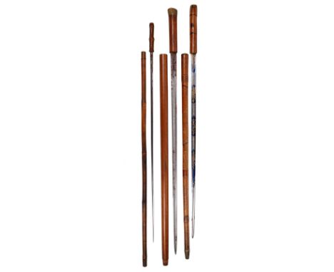 A collection of three 19th Century sword sticks, comprising: a heavy wooden cane with horn top, a straight pull revealing a 2