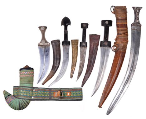 Five Middle Eastern daggers (jambiya), the first being a Marsh Arab example, double edged blade 9.5 in. with pronounced curve