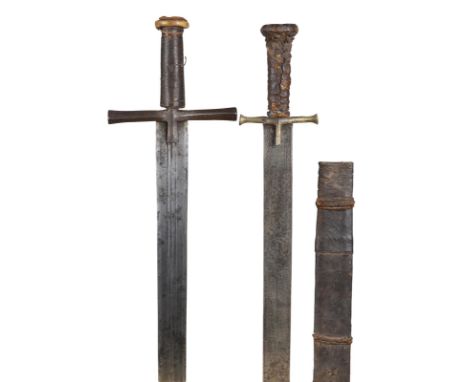 Two Sudanese swords (kaskara), the first with double edged blade 34 in., three narrow fullers at the forte, punched with cres