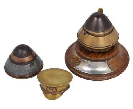 Two items of 'trench art': a brass and copper snuff box modelled as a British army cap with general service badge, and an ink