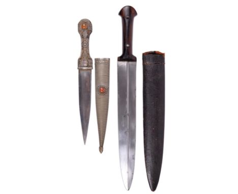 Two kindjal, the first with double edged blade 12 in., eccentric fullers, wooden hilt fixed to the tang with domed steel rive