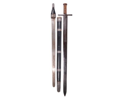 A Sudanese sword (kaskara), broad double edged blade 3 in., narrow fullers and stamped with two crescent moons to each side, 