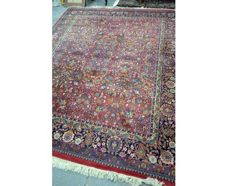 Persian red ground carpet with foliate forms and main blue border, 313cm x 250cmOverall in good order, no signs of major dama