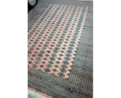 Afghan pink ground carpet with multiple borders, 302cm x 223cm Overall in good order, no signs of major damage, fading or sta