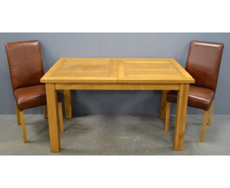 Light oak extending draw leaf dining table, on square legs and a set of four brown leather dining chairsDamage to top, veneer