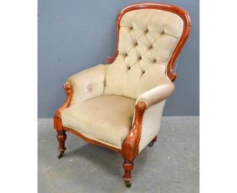 Victorian button back armchair with carved mahogany showframe.Top rail split open, braid missing in places, upholstery openin