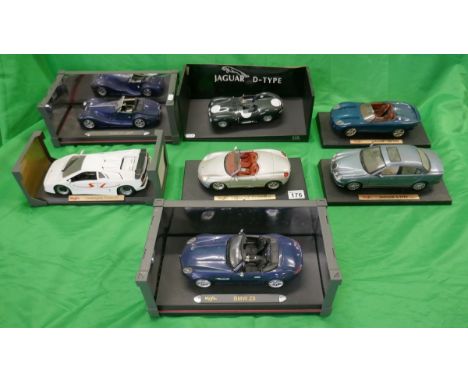 Collection of 7 1/18 scale diecast model cars