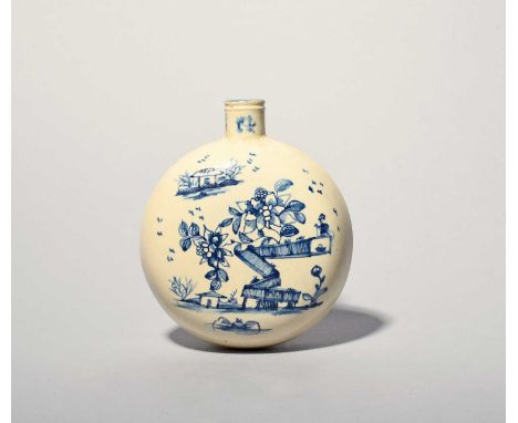 A creamware flask, c.1760-80, the flattened circular form painted in blue, one side with flowering branches issuing from a zi