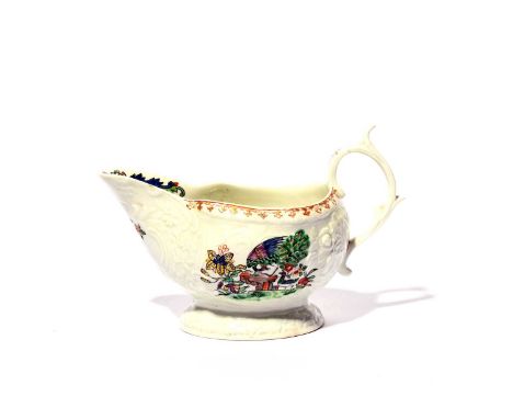 A large Philip Christian (Liverpool) sauceboat, c.1765-72, moulded with floral panels and brightly painted, one side with a p