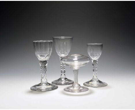 Three small wine glasses, c.1760-70, with ogee bowls cut to the base and raised on faceted stems over conical feet, and a sma