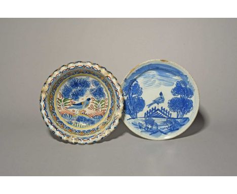A Bristol delftware wig bowl, c.1720, painted in polychrome enamels with a bird perched on a mound, with a crimped rim, and a