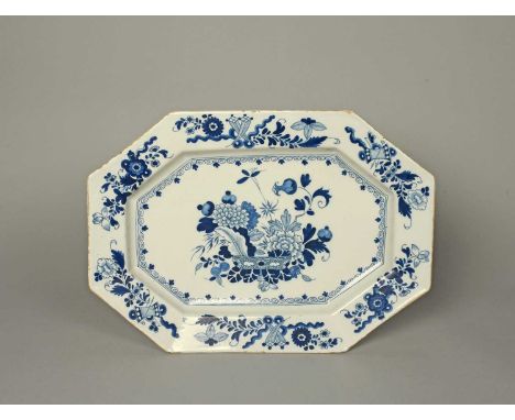 A large delftware charger, c.1760-70, probably Irish, painted in blue with a patterned censer of flowers including chrysanthe