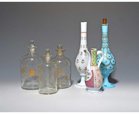 Six glass bottles for the Middle Eastern market, 19th century, three cut with trellis designs and gilt foliate motifs, one of