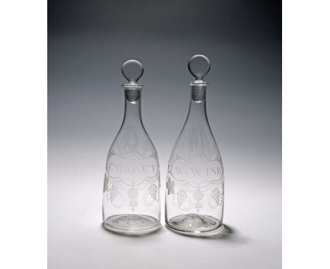 A pair of decanters and stoppers, late 18th century, of club shape, each engraved with a bottle ticket inscribed 'Claret' and