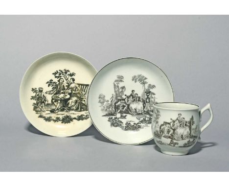 A Worcester cup and saucer, c.1755, printed in black with L'Amour, depicting a couple courting in a garden setting, the sauce