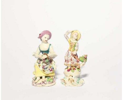 A Bow figure of a grape seller, c.1758-60, modelled as a young girl seated with a basket of grapes, wearing a floral patterne
