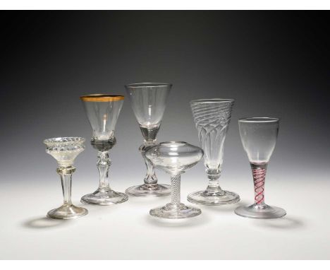 A dwarf ale glass, c.1750, with spiral moulded bowl over a short knopped stem, a miniature sweetmeat or cordial glass with ho