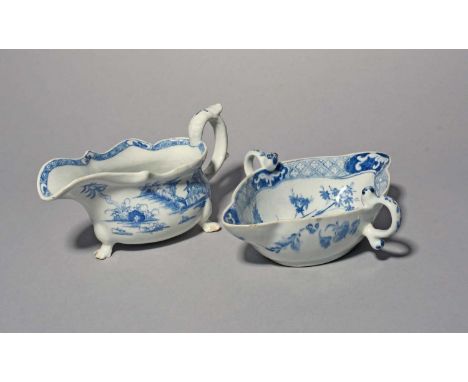 An early Bow blue and white sauceboat, c.1748-52, painted with a pagoda beneath tall trees, the interior with a tied scroll m