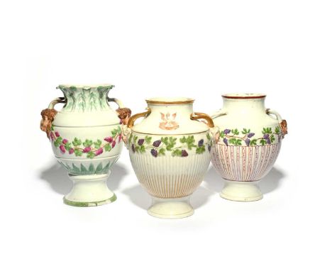 Three large Volkstedt two-handled vases, late 18th century, all moulded with a band of fruiting grapevine and applied with ho