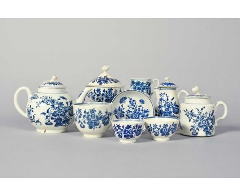 A collection of Worcester blue and white tea wares, c.1760-80, all printed in the Three Flowers pattern, including a teapot a